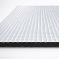 Close-up of Acoustic Lag with peel back surface on a white background