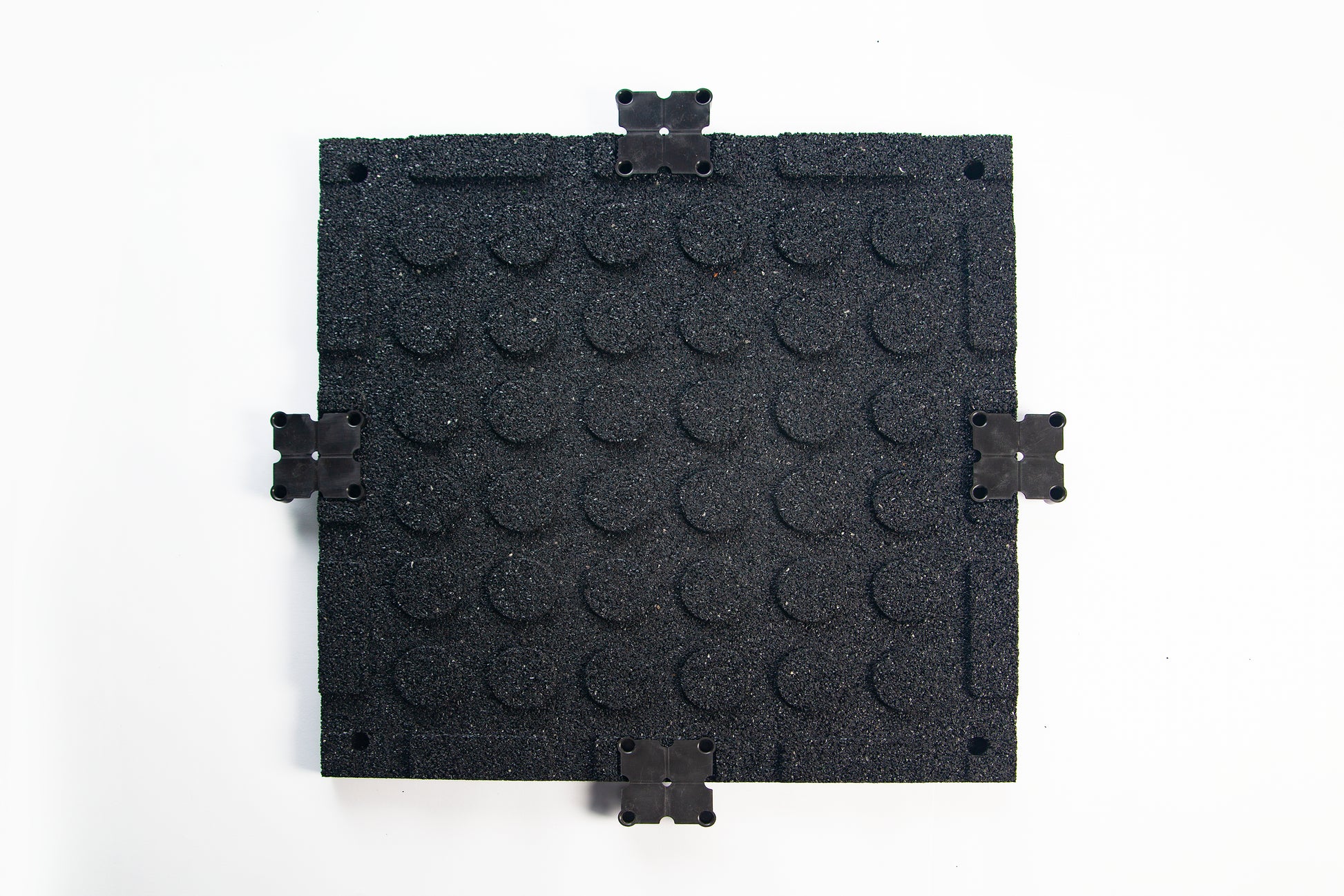 Full shot showing reverse side to TerraFit Duo gym tile, with connecting clips inserted along the perimeter