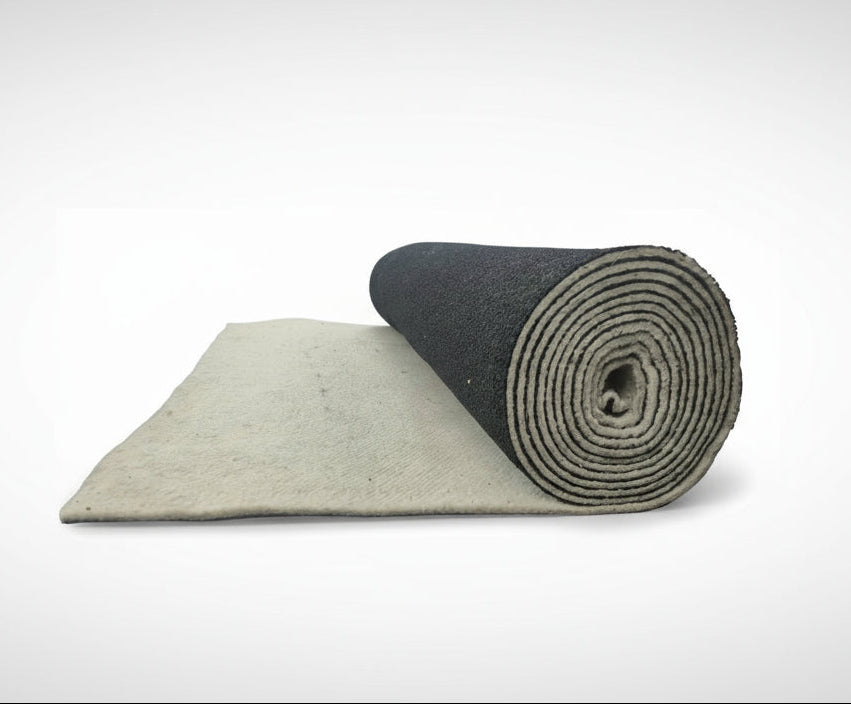 Roll of wool / rubber blend carpet underlay on a white background