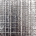 Metallic backing showing grid pattern on surface for malleable fitting 