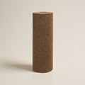 A full shot of dB Advanced LVT Underlay rolled and stood up. It's cylindrical with a brown and black fleck standing upright on a light beige background.