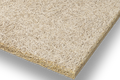 A rectangular panel of Troldtekt natural wood material sample shown at an angle on a clean white background, with a visible textured surface and slightly darker edge.